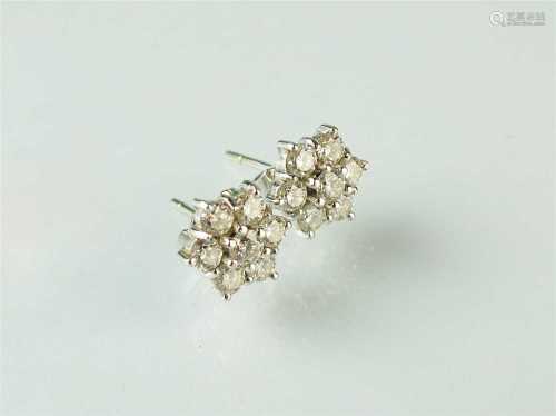 A pair of 18ct white gold diamond floral cluster earrings,