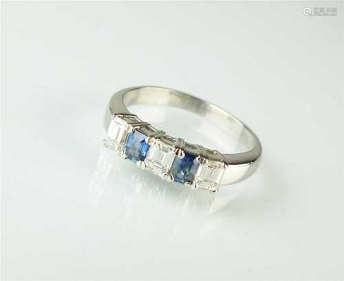 A five stone diamond and sapphire ring