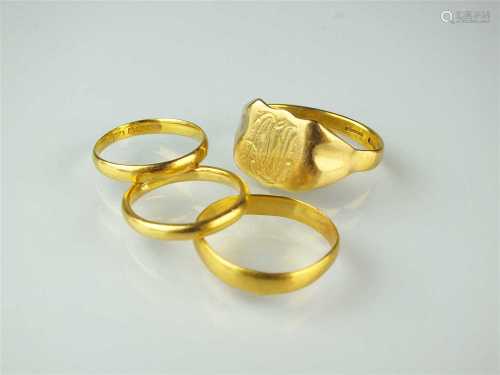 Four 22ct gold rings