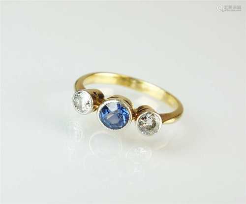 An early 20th century three stone sapphire and diamond ring