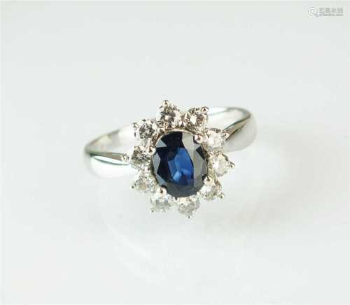 An 18ct white gold oval sapphire and diamond ring