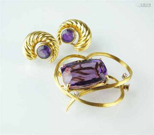 An amethyst and diamond brooch and a pair of amethyst earrings