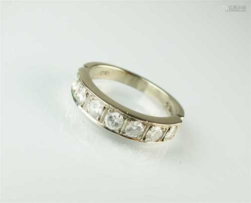 An 18ct white gold seven stone diamond ring