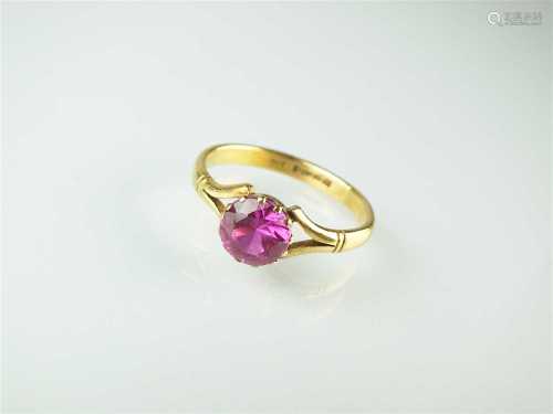 A synthetic pink sapphire ring