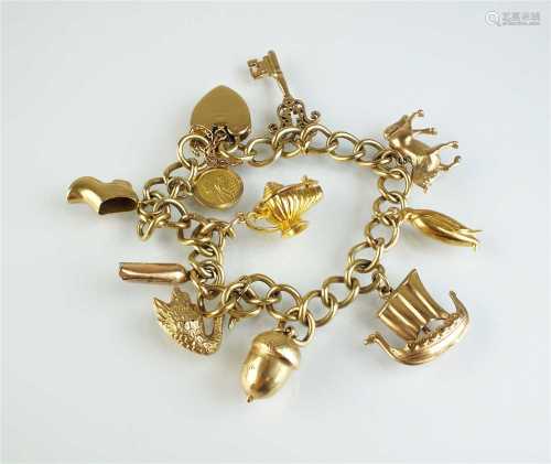 A 9ct gold bracelet with attached charms