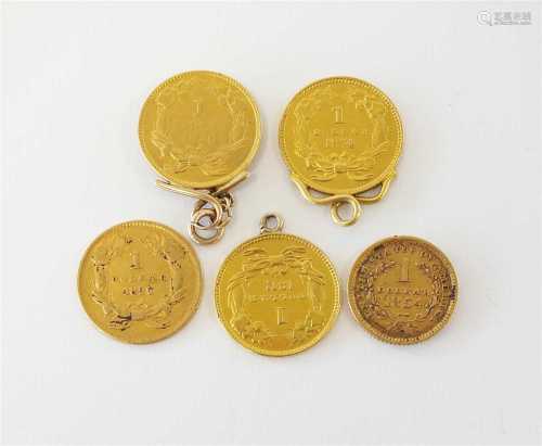 A collection of five gold USA coins