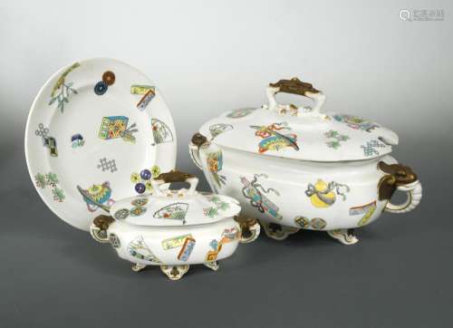 A Royal Worcester Aesthetic Movement part dinner service, the tureens with elephant mask handles and