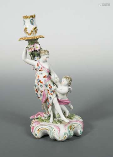 A Derby Patch Mark figural candlestick of 'Venus with Cupid', circa 1770, with foliate sconce and