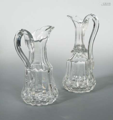 A Victorian ewer and jug, with shaped rims and scroll handles, the bodies of fluted form, 29cm and