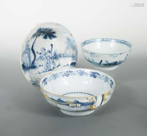 A London Delft blue and white shallow bowl, probably Lambeth, painted with two figures in a