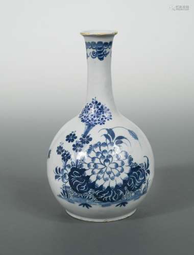 A Delft blue and white water bottle, probably Liverpool, circa 1750, painted with foliage, 23cm high