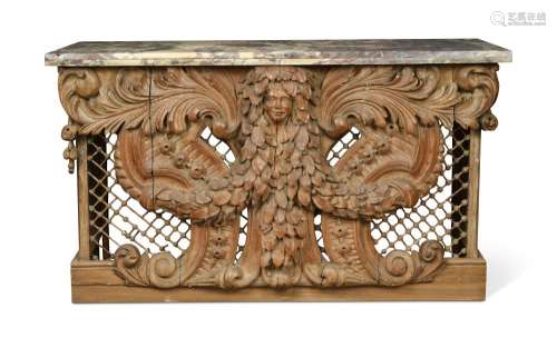 An early 18th century Dutch carved and pierced pinewood panel, with a breche violette marble,