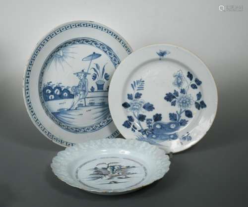 A Bristol Delft bianco-sopra-bianco plate, the centre decorated in polychrome with boats and figures