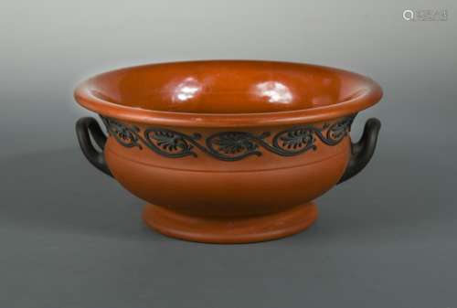 A 19th century Wedgwood Rosso Antico two-handled pedestal bowl, sprigged with a border of palmettes,