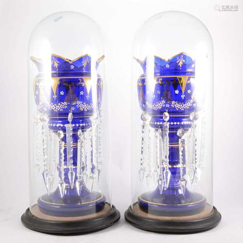 A pair of Victorian blue glass lustre vases