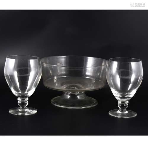 A large George III rummer, three other large rummers, and a pedestal glass bowl.