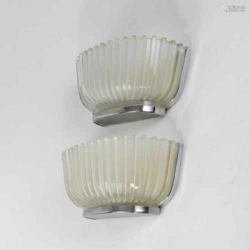 Italy, Two wall lights, 1940sTwo wall lights, 1940sH. 13.5 x 31 x 12.5 cm. Nickel-plated sheet