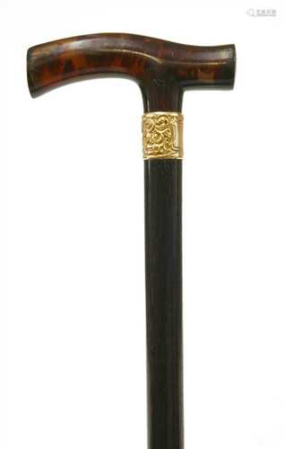 A tortoiseshell and ebonised walking stick,