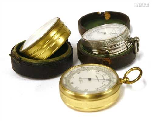 Three pocket barometer/altimeters,