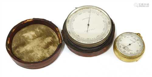 A silver-plated barometer/altimeter,