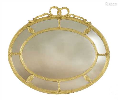 A Victorian gilt-framed oval mirror,