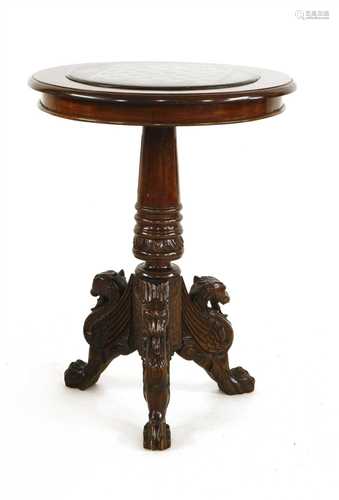 A carved walnut chess table,