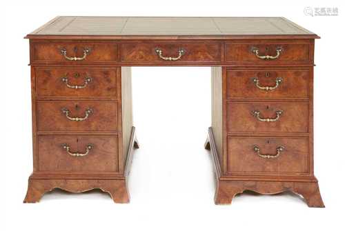 A burr elm twin pedestal desk,