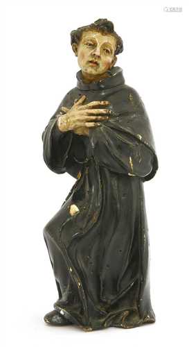 An early Spanish carved wood religious figure of a monk,