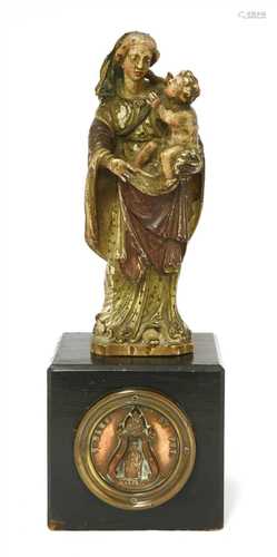 An early carved wood figure of the Madonna and Child,