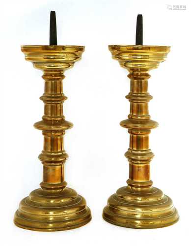 A pair of Flemish brass pricket candlesticks,