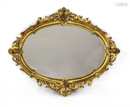 A large oval giltwood wall mirror,