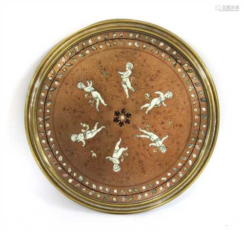 A circular copper plaque,