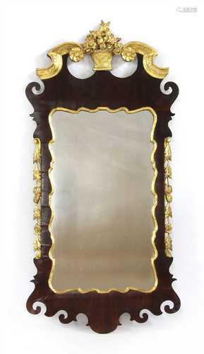 A George II walnut and gilt-highlighted wall mirror,