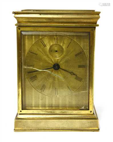 An unusual brass carriage timepiece,