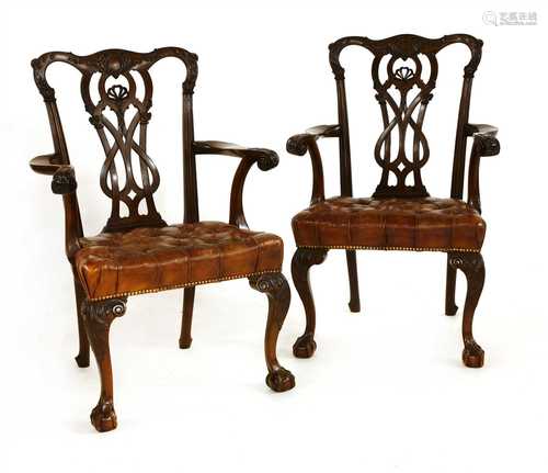 A pair of Chippendale-style mahogany open armchairs,