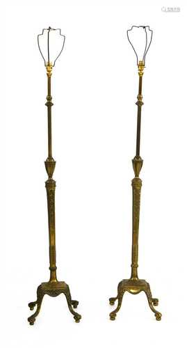 A near pair of brass adjustable standard lamps,