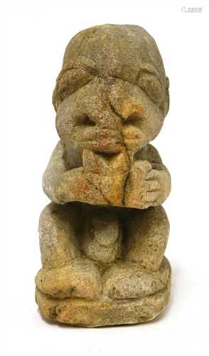 A Polynesian carved stone seated figure,