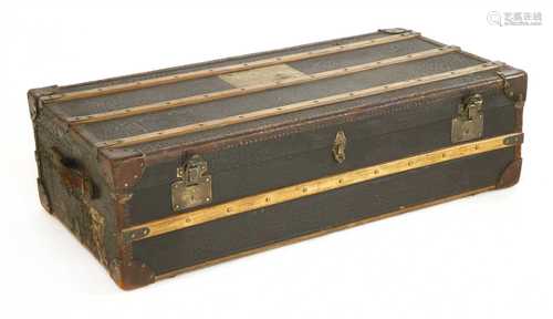 A leather and canvas bound travelling trunk,