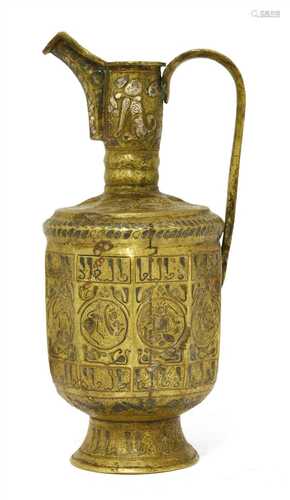 A Persian brass inlaid spouted ewer,