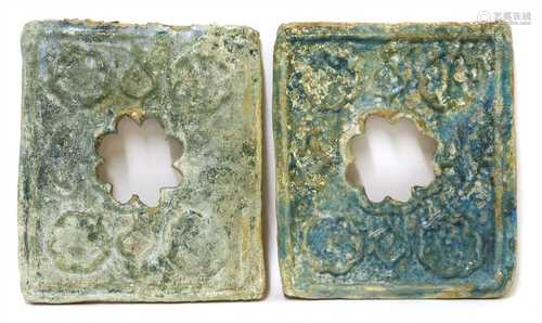 A pair of Kashan turquoise-glazed moulded pottery window tiles,