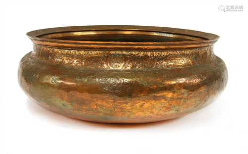 A large Persian copper basin,