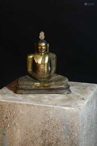 A gilt bronze figure of a seated Buddha,