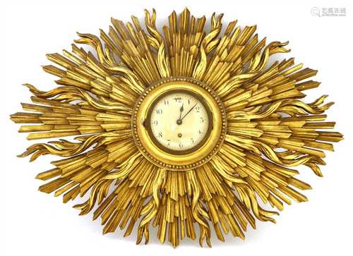 A carved and gilt sunburst wall clock,