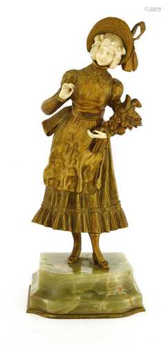 A French gilt bronze and carved ivory figure,