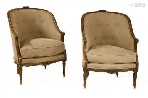 A pair of French walnut fauteuil tub chairs,