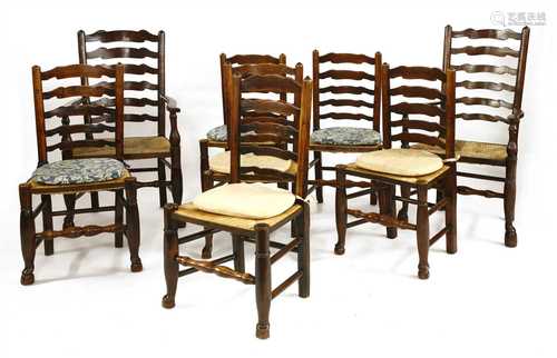 A set of eight oak and elm ladder back dining chairs,