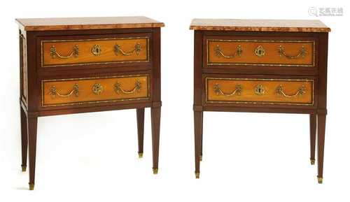 A pair of French mahogany and satinwood marble top commodes,