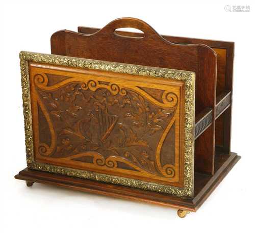 A carved oak and gilt gesso three-division canterbury,