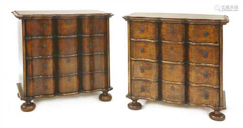 A pair of reproduction oak serpentine front commode chests,