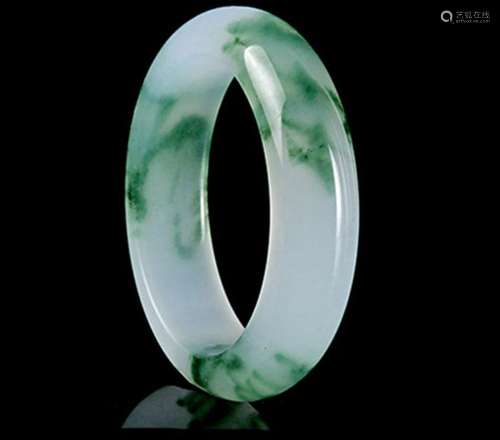 A NATURAL BURMA WAVE JADE BANGLE.